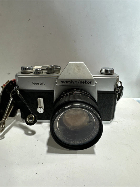 Mamiya/Sekor 1000 DTL 35mm SLR film camera with an Auto Mamiya/Sekor 52mm