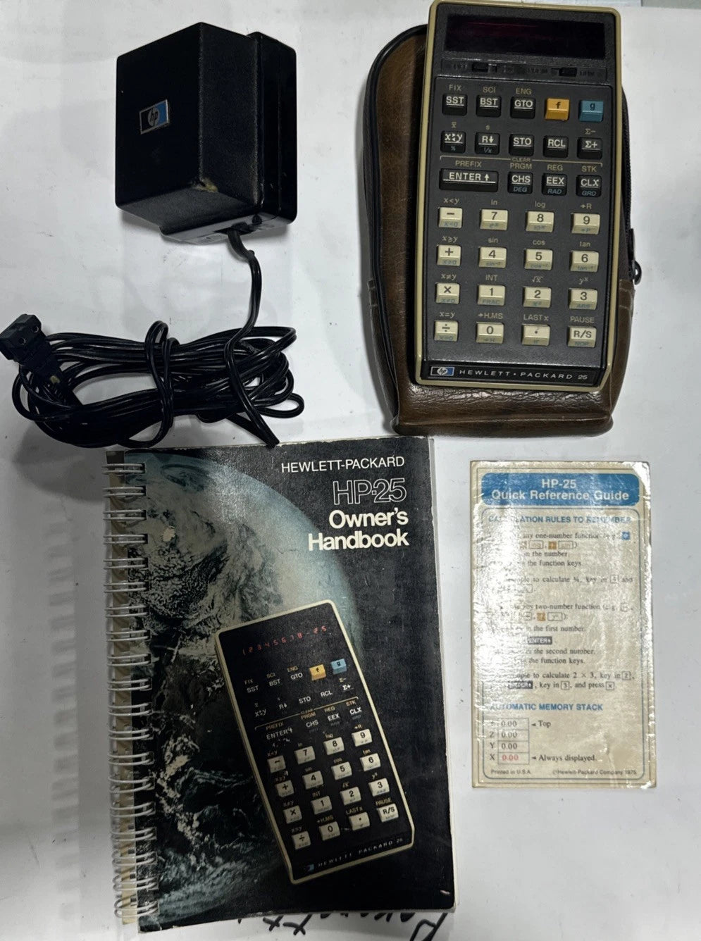 Hewlett-Packard HP 25 calculator W/ owner’s manual, Case, charger For Parts