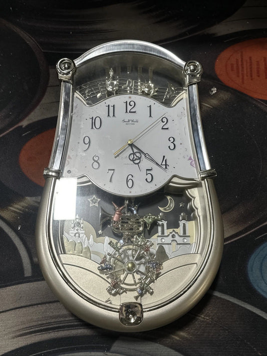 SMALL WORLD 4MH774 RHYTHM CLOCK CARNIVAL PLAYS SIX MELODIES SILVER READ